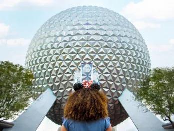 Spaceship Earth A girl looking up at Spaceship Earth, a large geodesic sphere