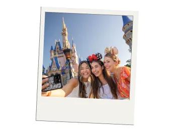 Budget Tips for Adults Visiting Walt Disney World Three young women taking a selfie in front of Cinderella Castle