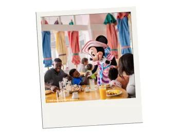 Buffet Dining at Walt Disney World Resort in Florida A polaroid image of a family meeting Minnie Mouse at a buffet restaurant