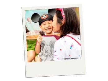 Dining Plans at Walt Disney World Resort in Florida A polaroid image of a young boy eating an ice cream while his mum kisses him on the cheek