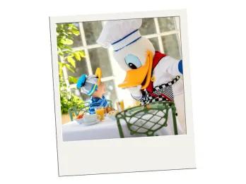 Dining on a Budget at Walt Disney World A polaroid of a child meeting Donald Duck in a chef outfit
