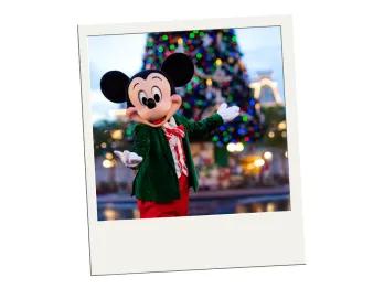 Seasonal Events on a Budget at Walt Disney World A polaroid of Mickey Mouse in front of a large Christmas tree