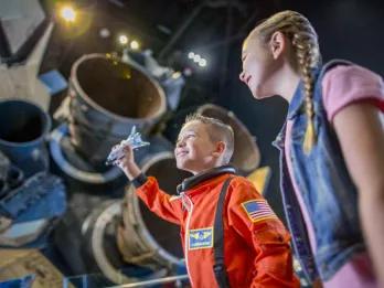 Kids exploring the Space Shuttle Atlantis exhibit, Kennedy Space Center in Florida