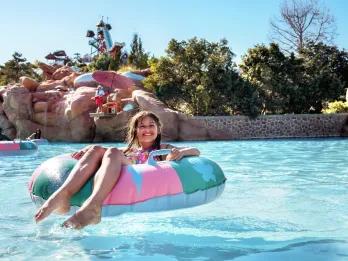 Meltaway Bay A young girl on a float in a wave pool