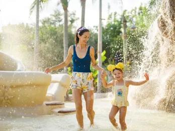 Ketchakiddee Creek A mother and daughter splashing in a children's water play area