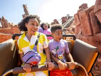 Big Thunder Mountain Railroad A boy and woman riding a rollercoaster