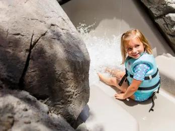 Bay Slides A young girl in a life vest about to go down a water slide