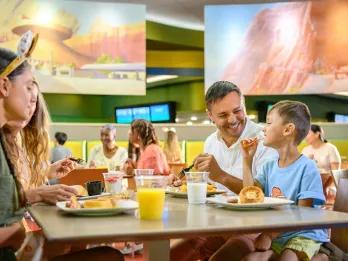 Disney Quick-Service Dining Plan A family eating a fast-casual breakfast in a restaurant