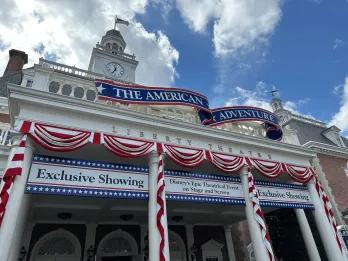 The American Adventure A building decorated with red, white and blue ribbons and signs