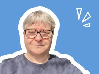 smiling female with short light hear wearing glasses, on a blue background