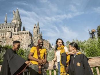 A family posing outside Hogwarts Castle in Universal Orlando Resort