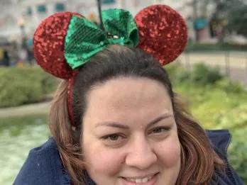 Juliana Smiling female wearing Disney mouse ears