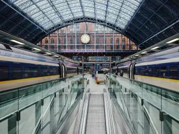 Train station with two Eurostar trains parked on either platform.