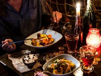 Full Board Meal Plan Two people eating at a restaurant table themed after Pirates of the Caribbean