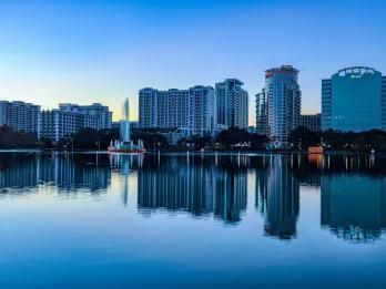 Houses reflecting in Lake Eola Park in Orlando