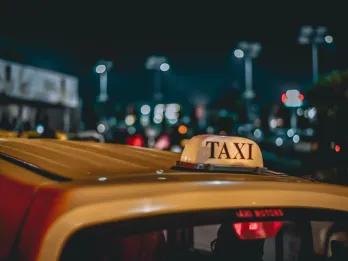 Yellow taxi in a big city.