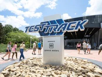 The white sign with blue text in capital letters saying "TEST TRACK".