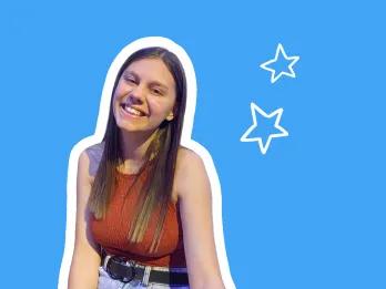 female in red top smiling, with blue background and white stars
