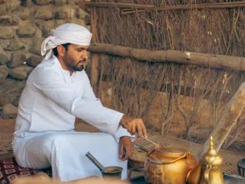 Bedouin Culture Safari Dubai Man performing live traditional Emirati cooking