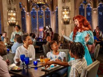 Ariel meeting a family sat at a table eating dinner