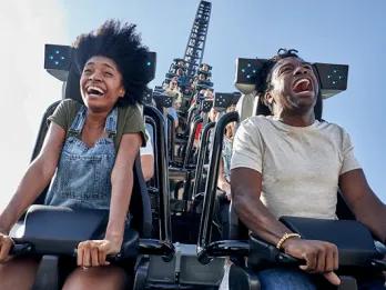 Guests riding Jurassic World VelociCoaster at Universal Islands of Adventure