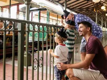 A family waiting for the Disney World Railroad