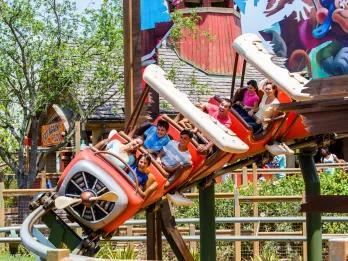 A rollercoaster designed to look like a propeller plane going down a small drop
