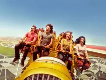 Yas Island People having fun riding Flying Faces at Ferrari World Yas Island