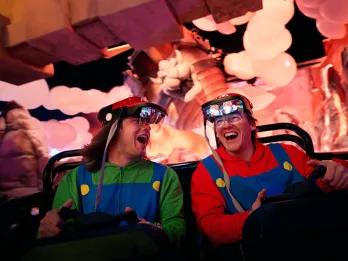 Happy guests enjoying a thrilling, immersive, and high-tech ride experience inside Universal Orlando Resort, showing how modern attractions are designed for diverse guest enjoyment and accessibility.