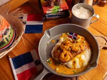 Delicious bowls of food with Latin American flag stuck in it.
