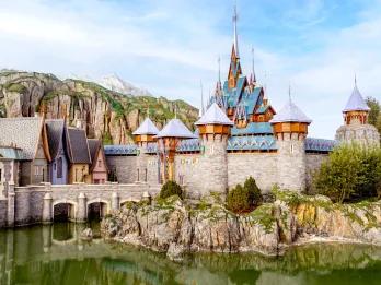 The kingdom of Arendelle with large castle by mountains