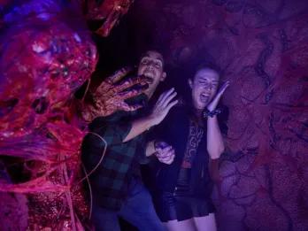 Guests in a scare house at Universal Halloween Horror Nights in Orlando