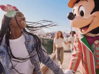 Guest with Mickey Mouse at Disney Adventure World