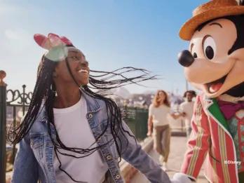 Guest with Mickey Mouse at Disney Adventure World