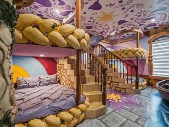 Rapunzel-themed children's bedroom with custom bunk beds and a central staircase