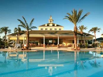 Reunion Resort clubhouse and pool near Kissimmee, one of the Orlando villa communities close to Walt Disney World