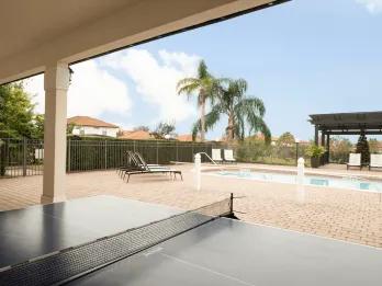 Table tennis and pool area at High Grove, a quieter Orlando villa community near Clermont
