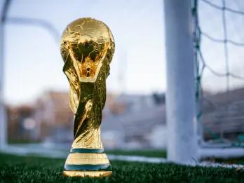 World Cup trophy on a football pitch
