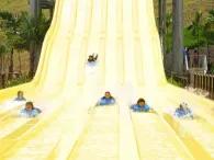 Family racing down LEGO Slide Racers at LEGOLAND Dubai Water Park
