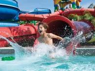 Boy on Twin Chasers Slide at LEGOLAND Water Park Dubai