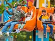 Family enjoying Fire & Ice Freefall ride at LEGO® MYTHICA: World of Mythical Creatures