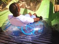 Man riding the Surge water slide at Aquaventure Dubai