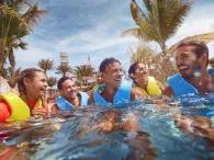 Friends enjoying Raging Rapids river ride at Aquaventure Dubai