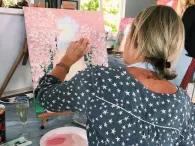 woman-painting-orchard