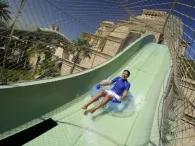 Plunge Happy rider on Plunge waterslide at Atlantis Aquaventure Waterpark