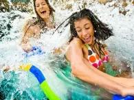 River Rapids Two women smiling as they float along the River Rapids at Atlantis Dubai Aquaventure Waterpark