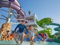 Splashers Cove Father and daughters running through Splashers Cove at Atlantis Dubai Aquaventure Waterpark