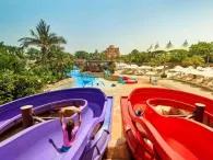 Splashers Island Children riding colourful water slides at Splashers Island, Atlantis Dubai Aquaventure