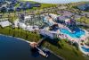 Beautiful aerial view of the lake and pools at the Storey Lake Resort