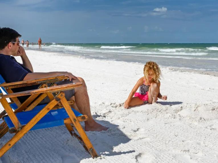 Father and daughtsers enjoying Clearwater Beach